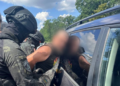 Мішки артилерії і тисячі доларів: поліція Київщини розкрила шахрайську схему